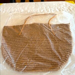 Brand  new summer bag with leather straps and metal closure.